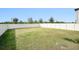 Large fenced backyard with grassy area at 3873 Gainer Spring Avenue, New Port Richey, FL 34653