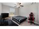 Bedroom with a full-size bed, gaming chair, and computer setup at 3873 Gainer Spring Avenue, New Port Richey, FL 34653