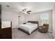 Main bedroom with plush carpet, ceiling fan and large window at 3873 Gainer Spring Avenue, New Port Richey, FL 34653