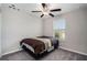 Spacious bedroom with a queen bed and window coverings at 3873 Gainer Spring Avenue, New Port Richey, FL 34653