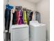 Bright laundry room with washer, dryer, and ample hanging space at 3873 Gainer Spring Avenue, New Port Richey, FL 34653