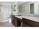 Bathroom features double vanity with granite countertop and shower at 4770 White Sanderling Ct, Tampa, FL 33619