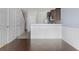 Bright dining room with hardwood floors and kitchen access at 4770 White Sanderling Ct, Tampa, FL 33619