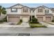 Townhouse with two-car garage and landscaping at 4770 White Sanderling Ct, Tampa, FL 33619