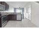 Modern kitchen featuring stainless steel appliances and granite countertops at 4770 White Sanderling Ct, Tampa, FL 33619