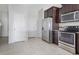 Kitchen with stainless steel appliances and ample cabinet space at 4770 White Sanderling Ct, Tampa, FL 33619