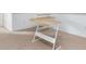 Cozy home office with L-shaped desk and carpeted floor at 4770 White Sanderling Ct, Tampa, FL 33619