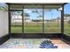Relaxing screened patio with a view of the backyard at 4770 White Sanderling Ct, Tampa, FL 33619