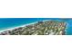 Aerial view of beachfront homes and neighborhood, showcasing oceanfront and bay views at 880 Mandalay Ave # C314, Clearwater Beach, FL 33767
