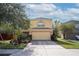 Charming two-story home with a two-car garage, driveway, and a well-maintained lawn and garden at 9703 33Rd E Ave, Palmetto, FL 34221