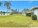 Lakefront property with a large backyard and screened patio at 2460 Terry Ln, Sarasota, FL 34231