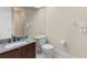 Small bathroom with granite countertop, dark brown cabinets, and a shower at 3025 Oakmont Dr, Clearwater, FL 33761