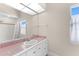Simple bathroom with pink tile and a vanity at 3025 Oakmont Dr, Clearwater, FL 33761