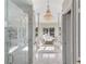 Luxurious bathroom with a large soaking tub, marble floors, and a chandelier at 3025 Oakmont Dr, Clearwater, FL 33761