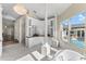 Spacious bathroom with a large soaking tub, double vanity, and pool view at 3025 Oakmont Dr, Clearwater, FL 33761