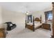 Spacious bedroom with a large wooden post bed and a ceiling fan at 3025 Oakmont Dr, Clearwater, FL 33761