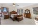 Bright bedroom with large windows and wood furnishings at 3025 Oakmont Dr, Clearwater, FL 33761