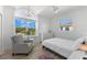 Charming bedroom with large window and hardwood floors at 3025 Oakmont Dr, Clearwater, FL 33761