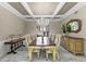 Elegant dining room featuring a crystal chandelier and hardwood floors at 3025 Oakmont Dr, Clearwater, FL 33761