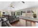 Bright Gathering room with hardwood floors, pool view, and comfortable seating at 3025 Oakmont Dr, Clearwater, FL 33761