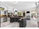 Gourmet kitchen boasts granite countertops and custom cabinetry at 3025 Oakmont Dr, Clearwater, FL 33761