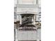 High-end kitchen with a Wolf range, custom cabinetry, and granite countertops at 3025 Oakmont Dr, Clearwater, FL 33761