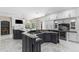 Gourmet kitchen features a large island, granite countertops, and custom cabinetry at 3025 Oakmont Dr, Clearwater, FL 33761
