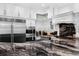 Modern kitchen features stainless steel appliances and sleek granite countertops at 3025 Oakmont Dr, Clearwater, FL 33761