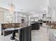 Open concept kitchen with large island, breakfast bar, and granite countertops at 3025 Oakmont Dr, Clearwater, FL 33761