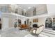 Spacious living room with high ceilings and marble floors at 3025 Oakmont Dr, Clearwater, FL 33761