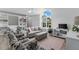 Cozy living room with built-in shelving and window seat at 3025 Oakmont Dr, Clearwater, FL 33761