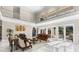 High-ceiling living room with marble floors and access to the pool at 3025 Oakmont Dr, Clearwater, FL 33761