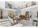 Bright living room with marble floors and ample seating at 3025 Oakmont Dr, Clearwater, FL 33761