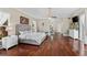 Bright main bedroom with hardwood floors and sitting area at 3025 Oakmont Dr, Clearwater, FL 33761