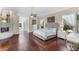Large main bedroom with hardwood floors and fireplace at 3025 Oakmont Dr, Clearwater, FL 33761