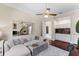 Comfortable sitting room with wet bar and hardwood floors at 3025 Oakmont Dr, Clearwater, FL 33761