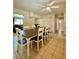 Dining room features a large table and ceiling fan at 1001 N Park Rd, Plant City, FL 33563