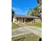 Brick ranch home with carport and spacious yard at 1001 N Park Rd, Plant City, FL 33563
