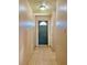 Bright hallway with tile floors and interior door at 1001 N Park Rd, Plant City, FL 33563