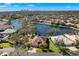 Scenic aerial view of a lakeside community and home in a lush, green setting at 1160 Darlington Oak Ne Dr, St Petersburg, FL 33703