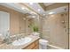 Modern bathroom showcasing a walk-in shower, granite counters, and ample vanity space at 1160 Darlington Oak Ne Dr, St Petersburg, FL 33703