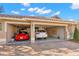 Spacious three-car garage featuring a red sports car and a white SUV at 1160 Darlington Oak Ne Dr, St Petersburg, FL 33703