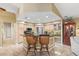 Well-lit kitchen with barstool seating, stainless appliances, and plenty of cabinet space at 1160 Darlington Oak Ne Dr, St Petersburg, FL 33703
