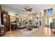 Elegant living room with a ceiling fan, sofa, armchair, large mirror and lots of natural light at 1160 Darlington Oak Ne Dr, St Petersburg, FL 33703