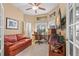 Comfortable office space with a desk, sofa, TV, and a window view at 1160 Darlington Oak Ne Dr, St Petersburg, FL 33703
