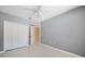 Simple bedroom with grey walls and double-door closet at 1420 Water View W Dr # 203, Largo, FL 33771
