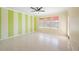 Bedroom with light walls, ceiling fan and hardwood floors at 1420 Water View W Dr # 203, Largo, FL 33771