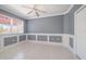 Well-lit bedroom with grey walls and a ceiling fan at 1420 Water View W Dr # 203, Largo, FL 33771