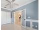 Spacious bedroom with light grey walls and wood-look flooring at 1420 Water View W Dr # 203, Largo, FL 33771