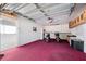 Garage with storage and two scooters at 1420 Water View W Dr # 203, Largo, FL 33771